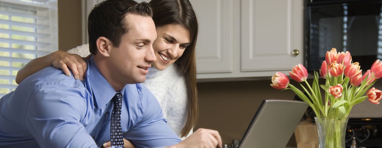 couple in a front of computer