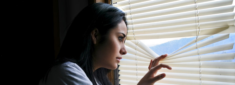 girl looking out window
